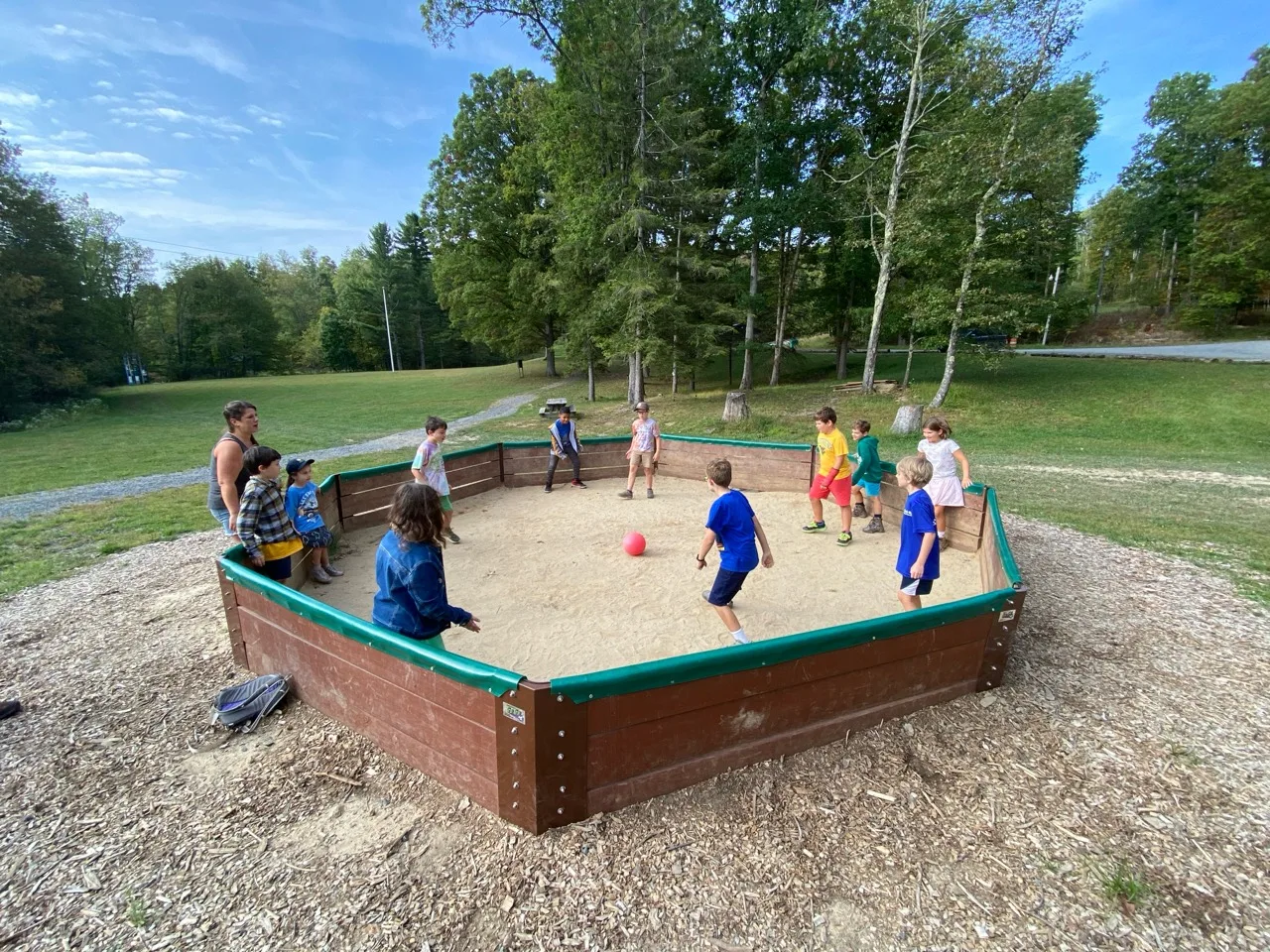 Scouts playing gaga ball outdoors at Camp Mountaineer